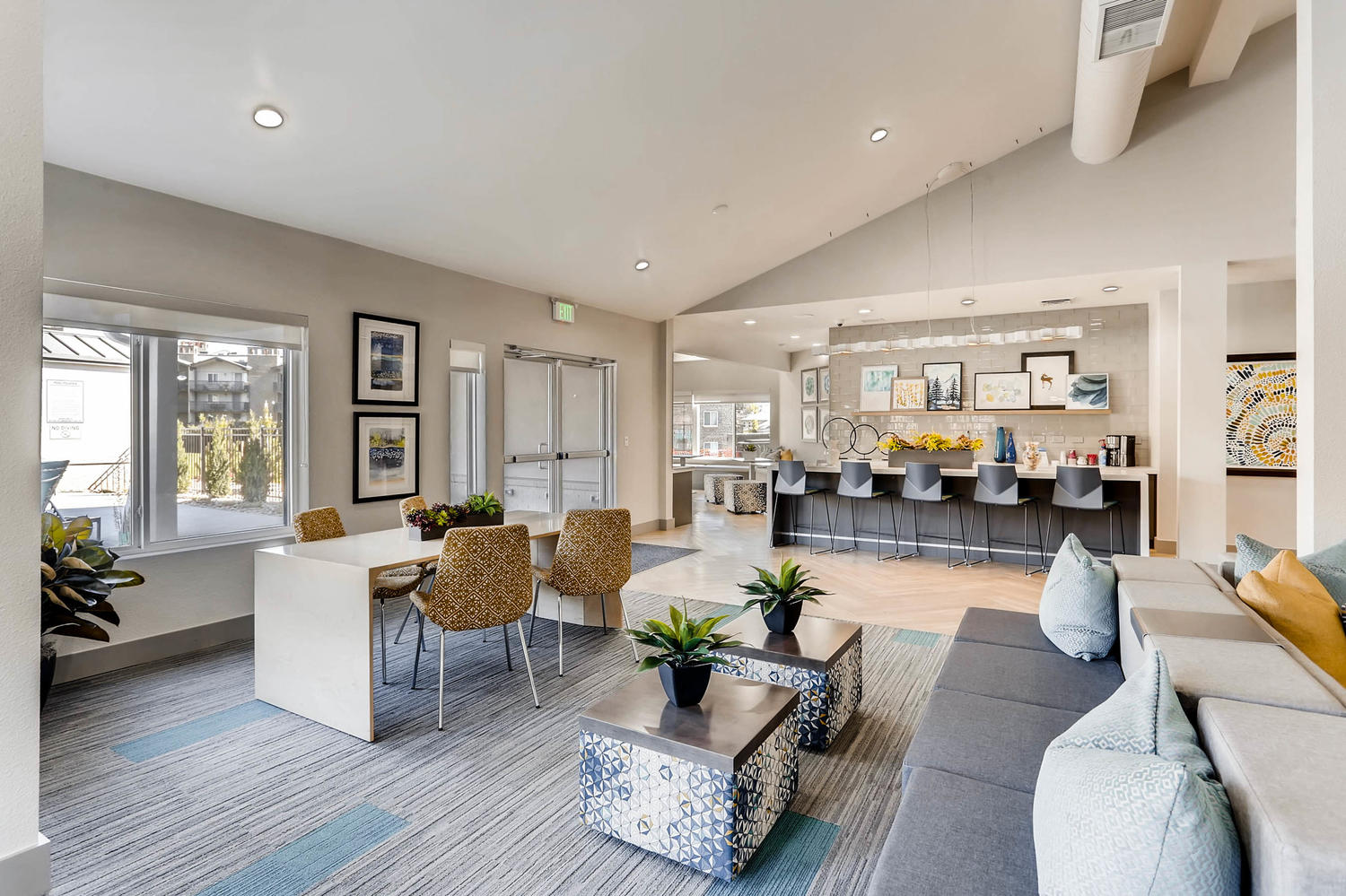 Clubhouse lounge with sofas and tables and demonstration kitchen